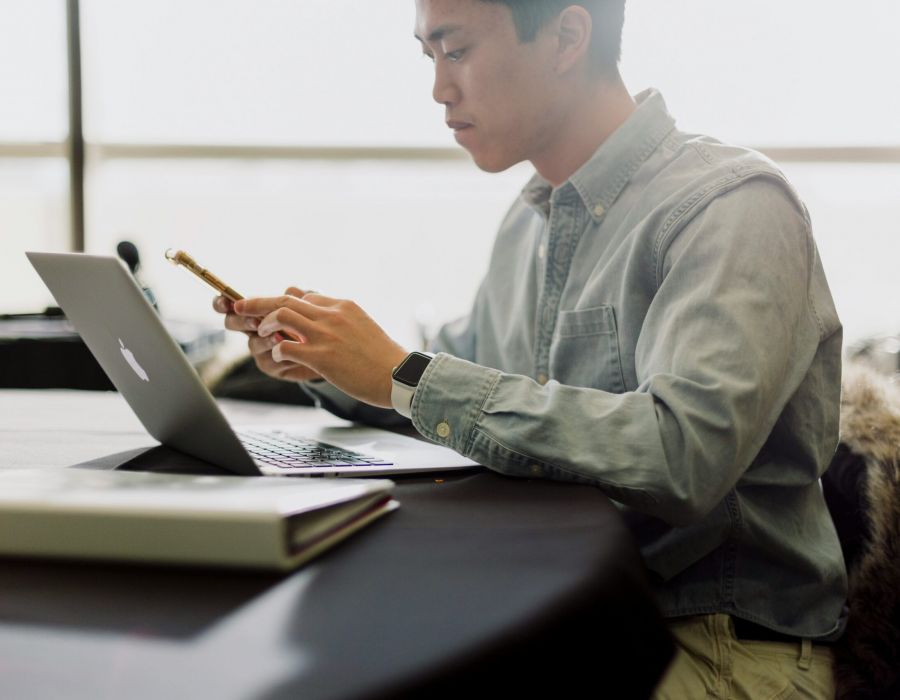 Man working on laptop in coworking space