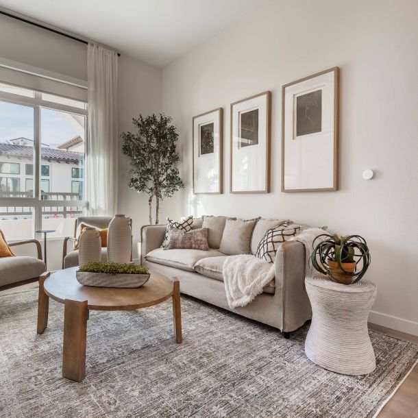 Spacious living room with hardwood-style flooring at Solana Winchester Hills luxury apartments in Temecula.